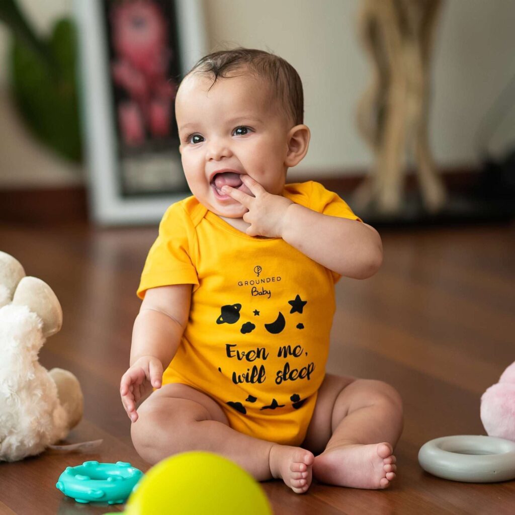Grounded - Baby Kaya in a Yellow Onesie scaled 1